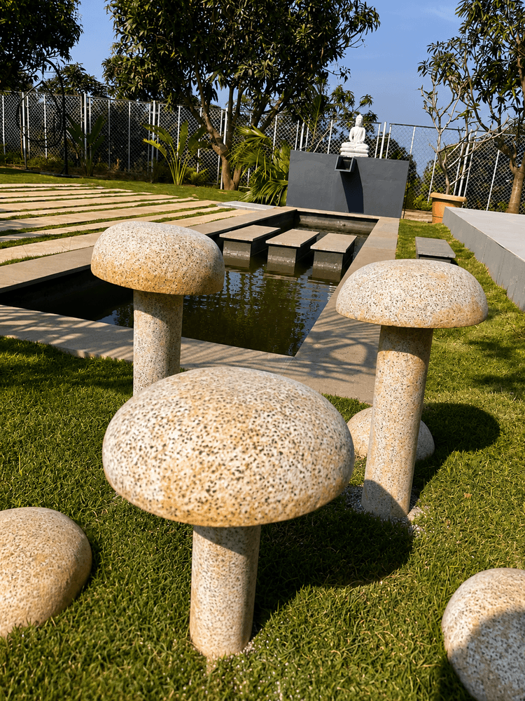 Stone seating beside the water feature at Gable Grove